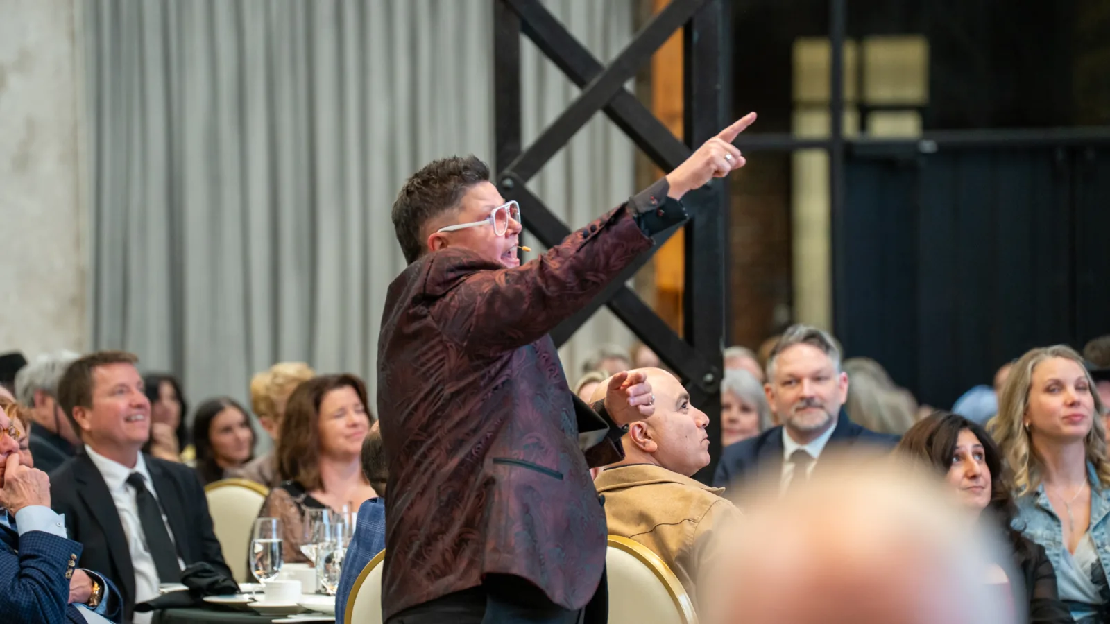 Layne, the auctionista guiding entertainment at CMHReveal 2026